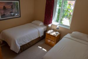 מיטה או מיטות בחדר ב-Sandy Beach Suites
