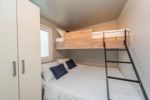 Postel nebo postele na pokoji v ubytování Mobile home Pecten Exclusive 1