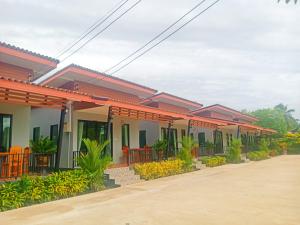 a row of houses on a street at Noppakhun Resort in Ban Mai