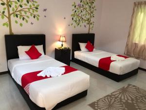 Ένα ή περισσότερα κρεβάτια σε δωμάτιο στο De Langkawi Resort and Convention Centre