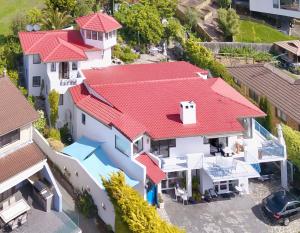 an aerial view of a house with red roofs at Million Dollar Views in Hobart