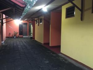 an empty hallway of a house with a building at Hotel SiCantik in Kaliurang