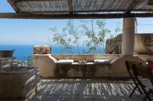 an outdoor bathroom with a view of the ocean at Casa Falco Della Regina in Filicudi