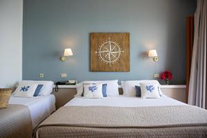 Postel nebo postele na pokoji v ubytování Hotel Punta Nord Est
