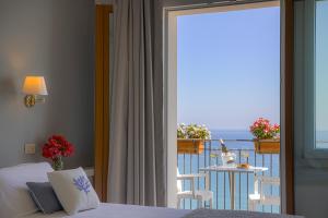 Postel nebo postele na pokoji v ubytování Hotel Punta Nord Est