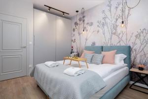 Posteľ alebo postele v izbe v ubytovaní Exclusive Apartments Mostowa by Renters Prestige