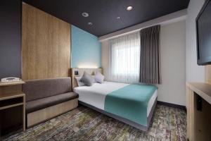 Postel nebo postele na pokoji v ubytování Hotel Villa Fontaine Tokyo-Kayabacho