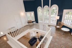 an overhead view of a living room with a staircase at Mami Sabaudia Hotel in Sabaudia