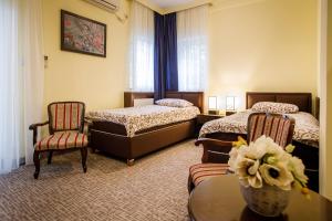 Säng eller sängar i ett rum på Villa Modena