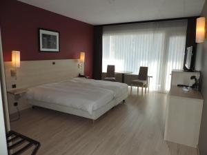 Voodi või voodid majutusasutuse Hotel Panorama toas