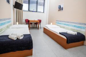 Postel nebo postele na pokoji v ubytování Hotel VP1