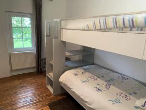Postel nebo postele na pokoji v ubytování La Part des Anges