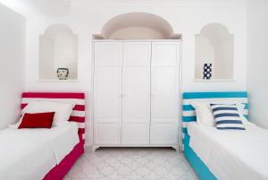 Ένα ή περισσότερα κρεβάτια σε δωμάτιο στο Maison Zara - Positano Amalfi Coast