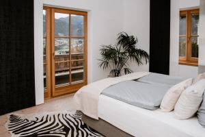 Postel nebo postele na pokoji v ubytování Residenz am Berg