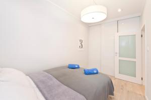 Posteľ alebo postele v izbe v ubytovaní Apartamenty Grobla III Q4Apartments