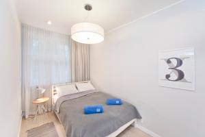 Posteľ alebo postele v izbe v ubytovaní Apartamenty Grobla III Q4Apartments