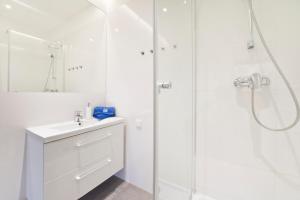 Kúpeľňa v ubytovaní Apartamenty Grobla III Q4Apartments