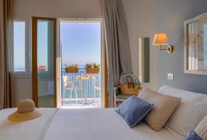 Postel nebo postele na pokoji v ubytování Hotel Punta Nord Est