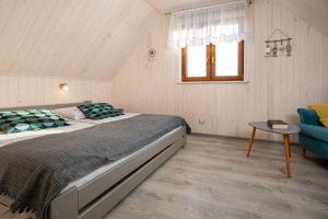 Postel nebo postele na pokoji v ubytování Domki Magnati