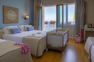 Postel nebo postele na pokoji v ubytování Hotel Punta Nord Est