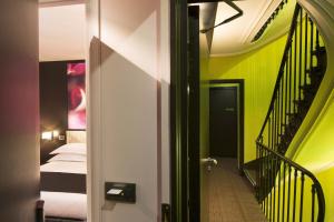 Postel nebo postele na pokoji v ubytování Hôtel Le Fabe + 46 fotografií