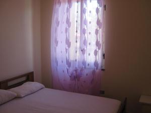 
Ein Bett oder Betten in einem Zimmer der Unterkunft Residenza Altmar
