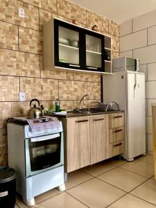 Dapur atau dapur kecil di Residencial Sandini Garopaba