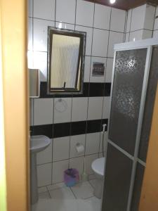 Ein Badezimmer in der Unterkunft Kata Suites Floripa