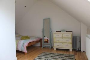 The Barn @ Mill Haven Place, 3 bedroom cottage tesisinde bir odada yatak veya yataklar