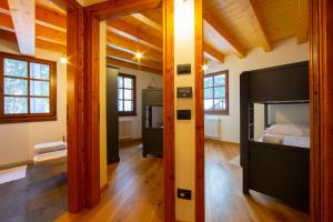 a bedroom with a large bed and a bathroom at WILDHOMES Wild Wolf Lodge in Courmayeur
