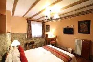 Postelja oz. postelje v sobi nastanitve Hotel & Mirador Los Apus