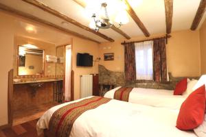Postelja oz. postelje v sobi nastanitve Hotel & Mirador Los Apus