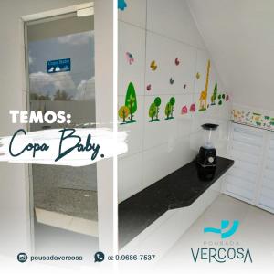Pousada Verçosa - Rota Ecológica dos Milagres في Passo de Camarajibe: غرفة بجدار أبيض عليها ملصقات