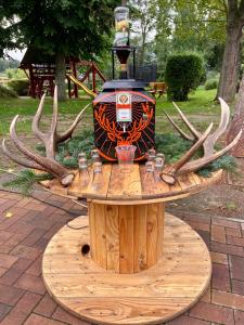 a wooden table with antlers on top of it at Hotel Am Park in Pasewalk