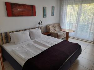 Postel nebo postele na pokoji v ubytování Guest House Móritz