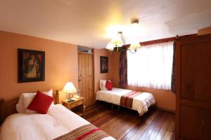 Postelja oz. postelje v sobi nastanitve Hotel & Mirador Los Apus