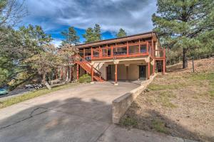 a house with a deck on the side of it at Airy Alto Escape 1 Mi to Ruidoso Winter Park in Alto