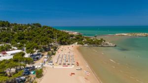 an aerial view of a beach with a group of people at Villaggio Capo Vieste in Vieste