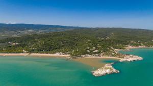 an aerial view of a small island in the ocean at Villaggio Capo Vieste in Vieste