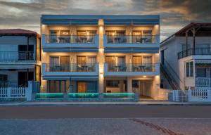 a large building with lights on the side of it at Privilege Luxury Living in Sarti