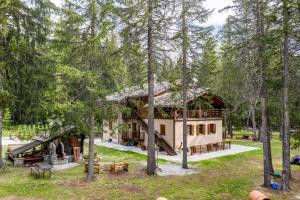 a house in the middle of the woods at WILDHOMES Wild Wolf Lodge in Courmayeur