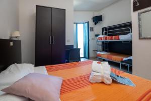 Postel nebo postele na pokoji v ubytování Hotel Ancore