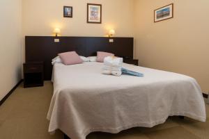 Postel nebo postele na pokoji v ubytování Hotel Ancore