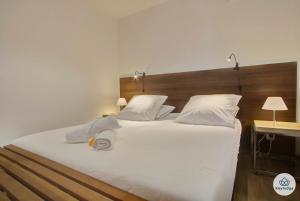 Een bed of bedden in een kamer bij Padam*** - 69m² - Vue sur la mer - Sainte-Marie