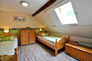 Tempat tidur dalam kamar di Ferienwohnungen Kachel