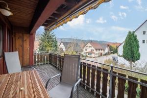 a balcony with a table and chairs and a view at Studiowohnung Haus 18 in Überlingen