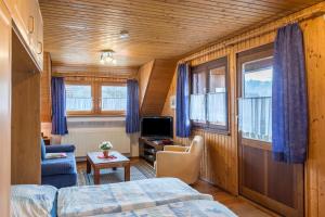 a bedroom with a bed and a tv in a room at Studiowohnung Haus 18 in Überlingen