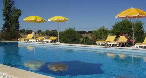 The swimming pool at or near Monte Da Serralheira Agro Turismo