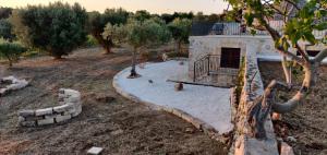 A garden outside Trullo la perla di pietra