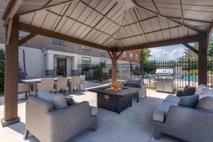 a pavilion with couches and tables and a grill at Holiday Inn Express Exton - Great Valley, an IHG Hotel in Exton